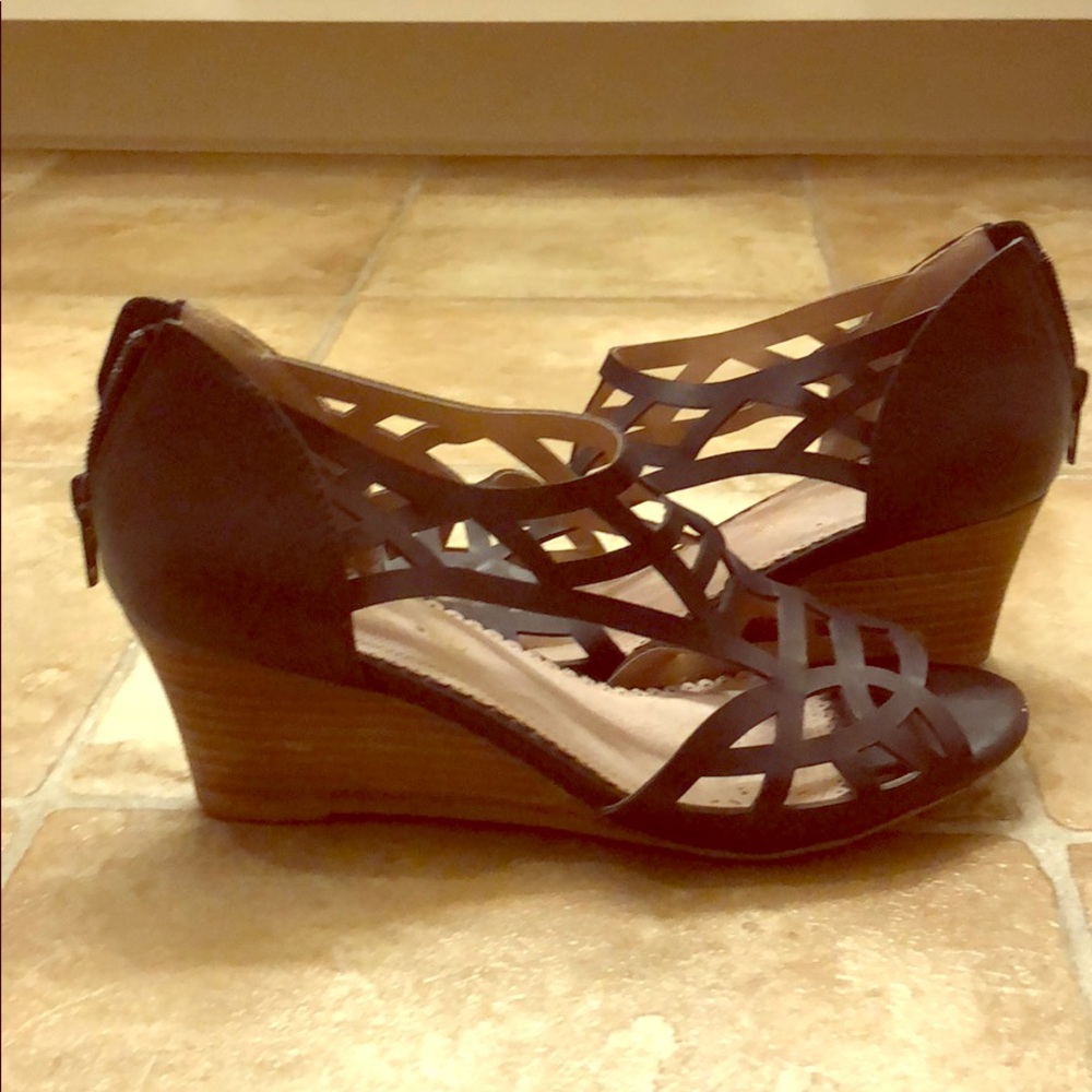 Restricted leather wedge heels in black. Size 6